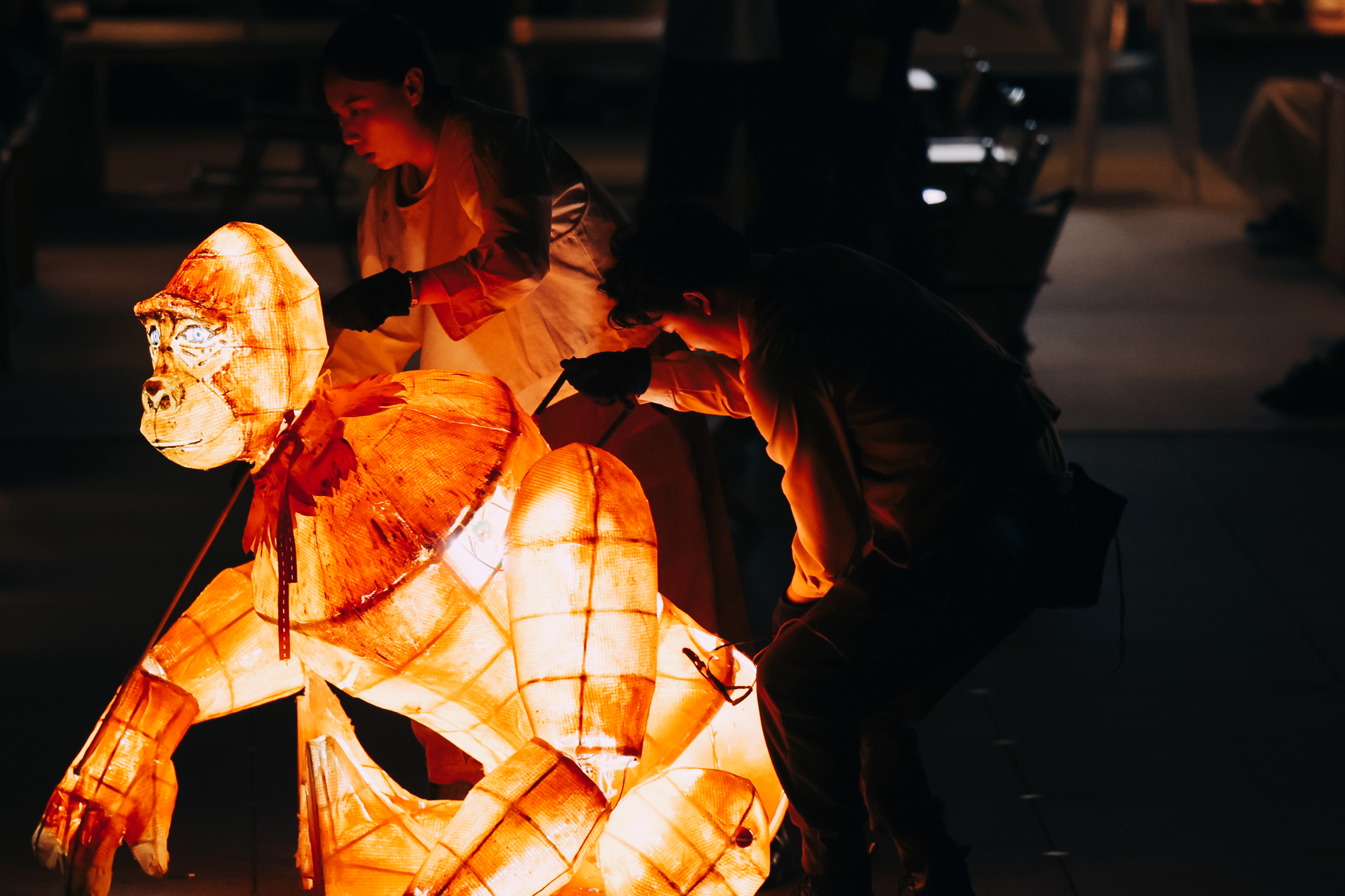 Large glowing animal puppet in performance